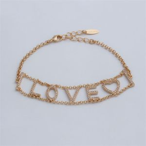 PULSEIRA FOLHEADO A OURO COM PALAVRA LOVE COM CORAÇÃO DE ZIRCÔNIAS