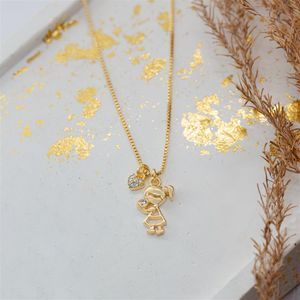 COLAR FOLHEADO A OURO COM MENINA E CORAÇÃO DE ZIRCÔNIAS