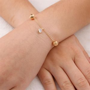 PULSEIRA FOLHEADA A OURO FIO COM BOLAS E 1 ZIRCÔNIA