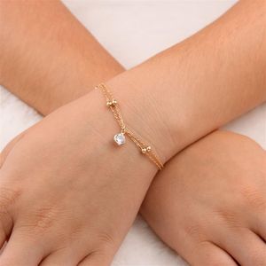 PULSEIRA FOLHEADO A OURO 2 FIOS DE BOLINHAS E COM ZIRCÔNIA