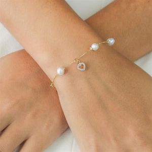 PULSEIRA FOLHEADO A OURO PÉROLAS COM MINI CORAÇÃO