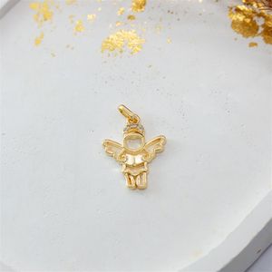 PINGENTE FOLHEADO A OURO MENINO ANJO COM LIVRO E ZIRCÔNIAS