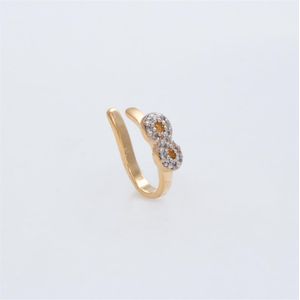 PIERCING DE ORELHA FOLHEADO A OURO COM INFINITO DE ZIRCÔNIAS