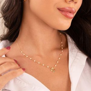 COLAR FOLHEADO A OURO DE PÉROLAS E COM MENINO E MINI CORAÇÃO