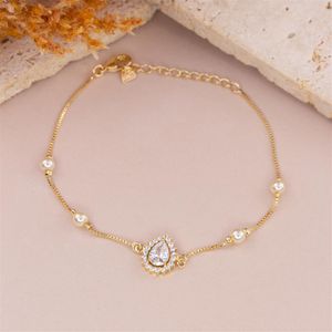 PULSEIRA FOLHEADO A OURO COM PÉROLAS E GOTA EM ZIRCÔNIA