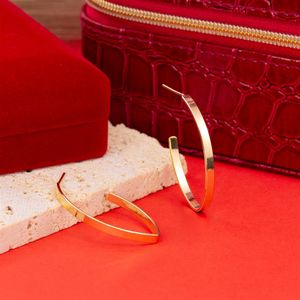 BRINCO FOLHEADO A OURO ARGOLA OVAL FINA E LISA